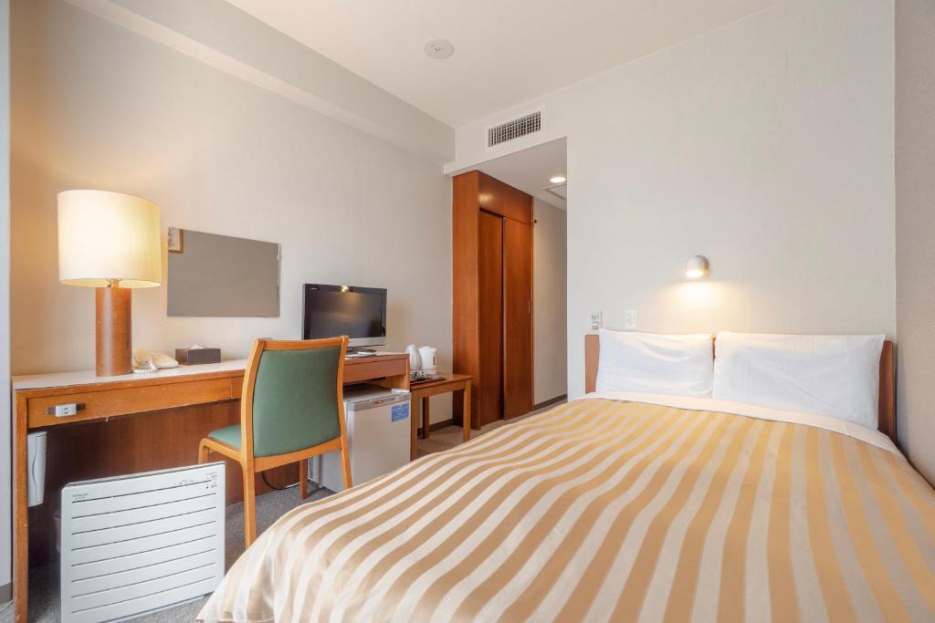 Postel nebo postele na pokoji v ubytování Hotel Gimmond Kyoto