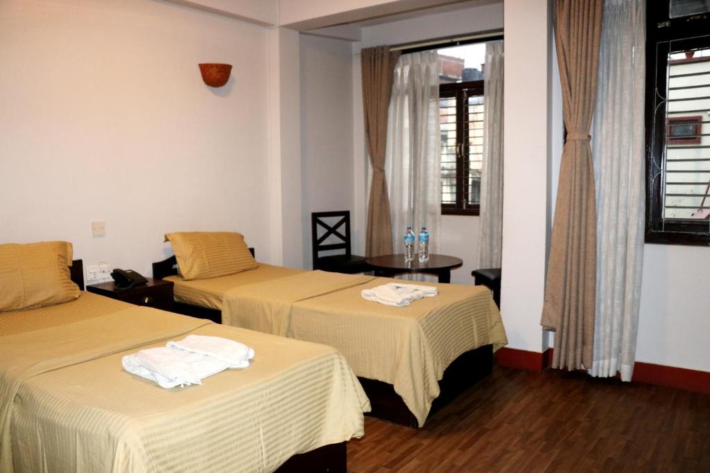Postel nebo postele na pokoji v ubytování Hotel Yala Peak