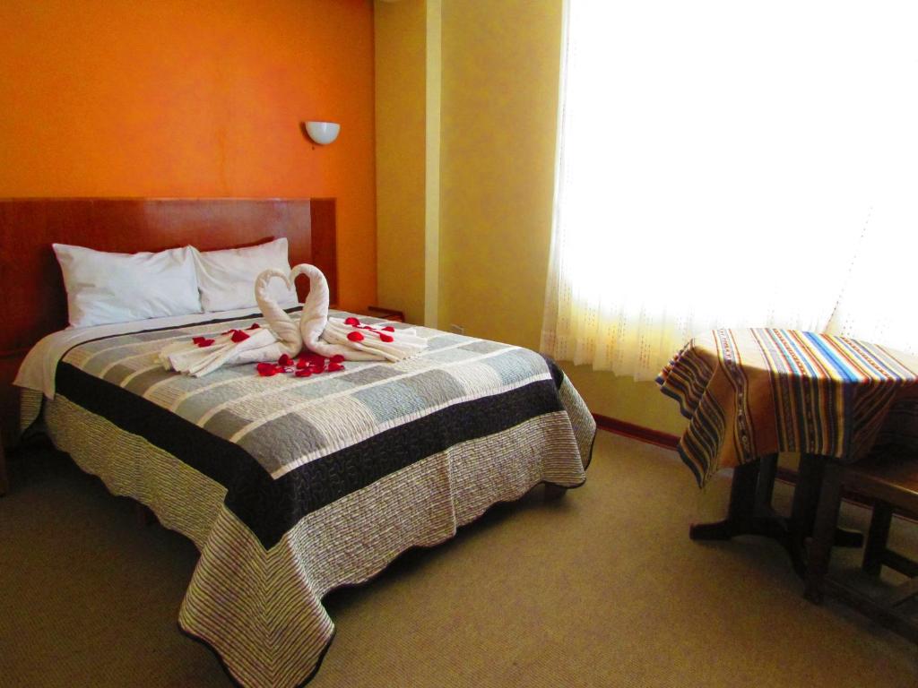 Postel nebo postele na pokoji v ubytování Maya Inn