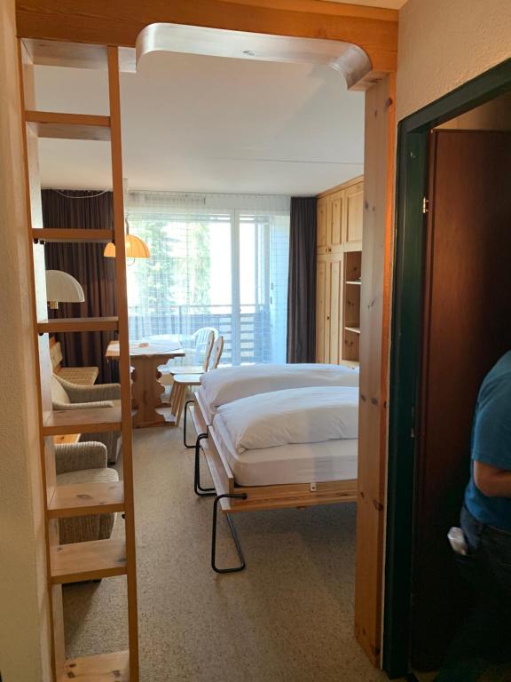 Letto o letti in una camera di Hotel des Alpes