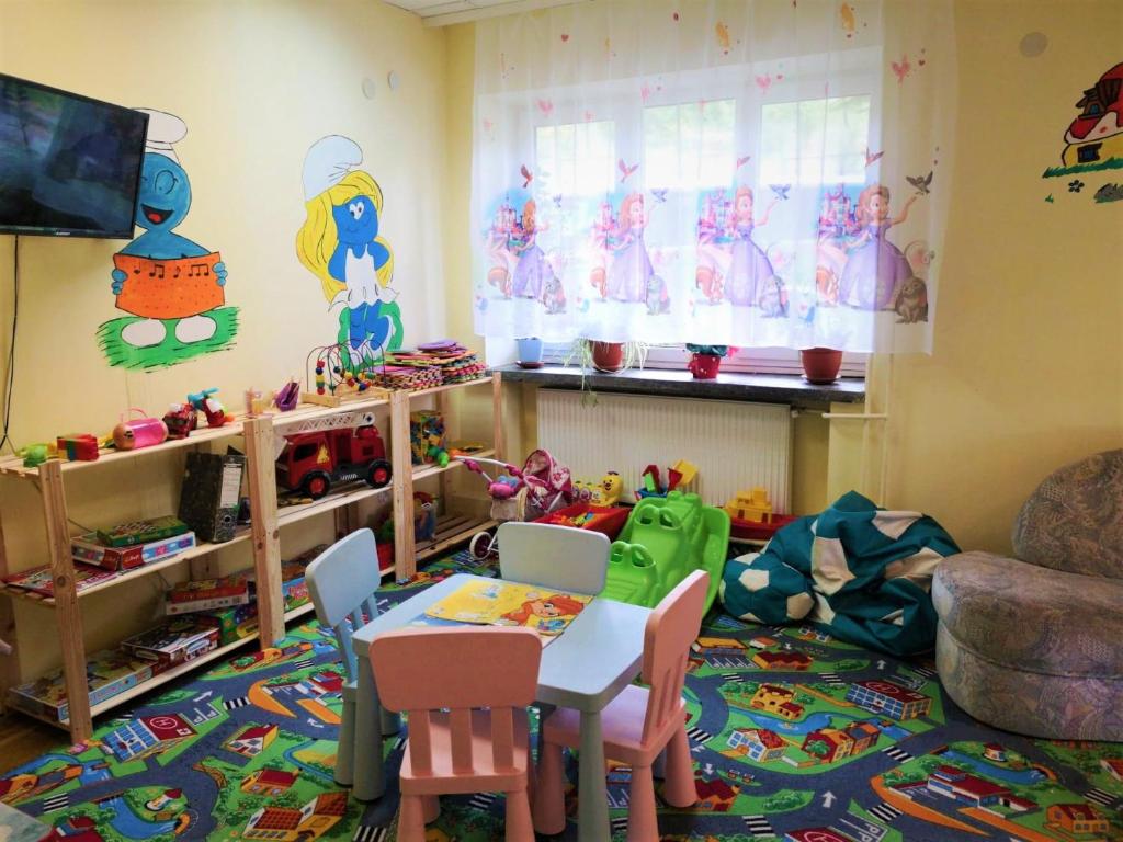 TV a/nebo společenská místnost v ubytování Ośrodek Wypoczynkowy Baśka