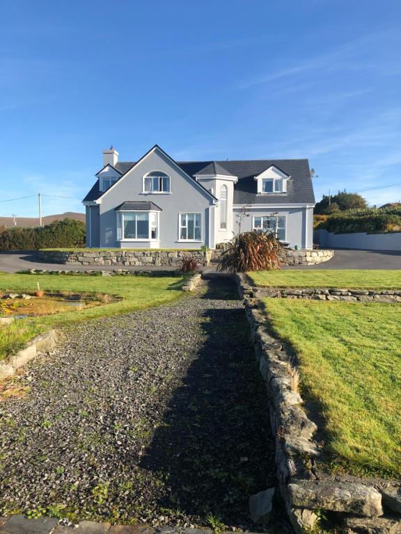 a large white house with a stone driveway at Creevagh (Room Only) in Keel
