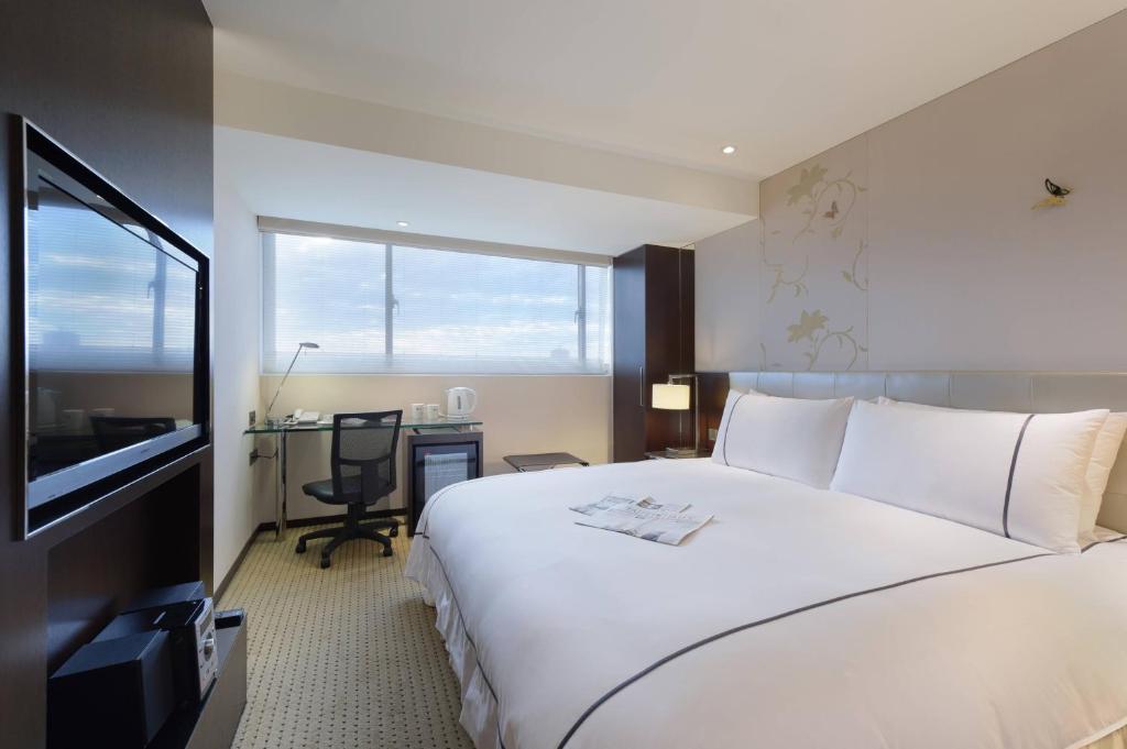 Postel nebo postele na pokoji v ubytování K Hotel Taipei Dunnan