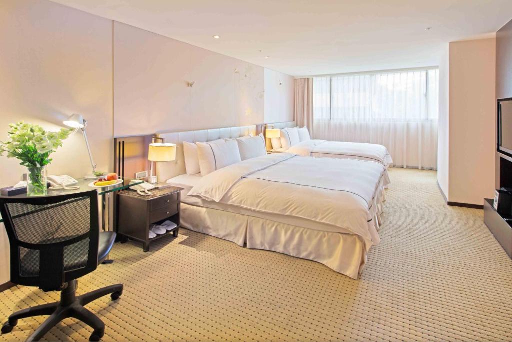Postel nebo postele na pokoji v ubytování K Hotel Taipei Dunnan