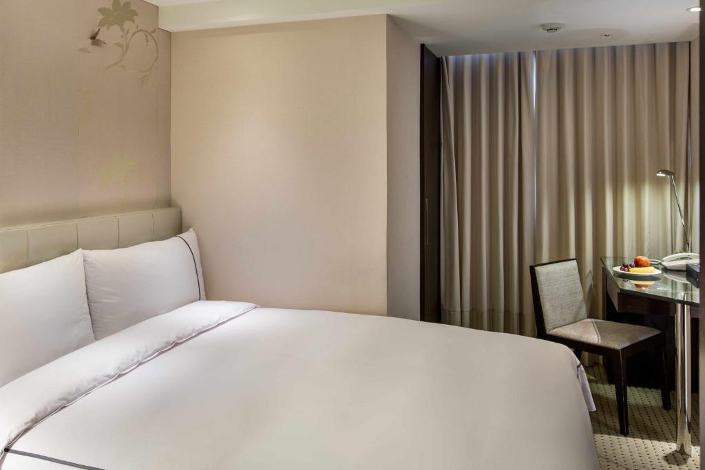 Postel nebo postele na pokoji v ubytování K Hotel Taipei Dunnan
