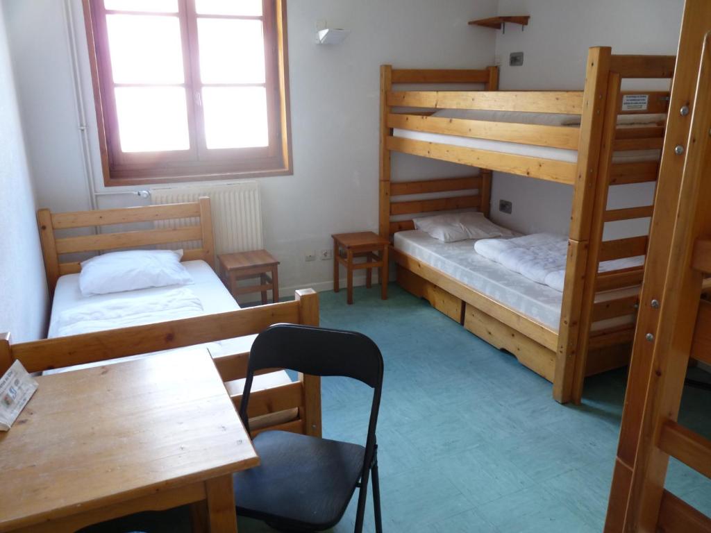 Postel nebo postele na pokoji v ubytování Gite l'Aiguillette du Lauzet