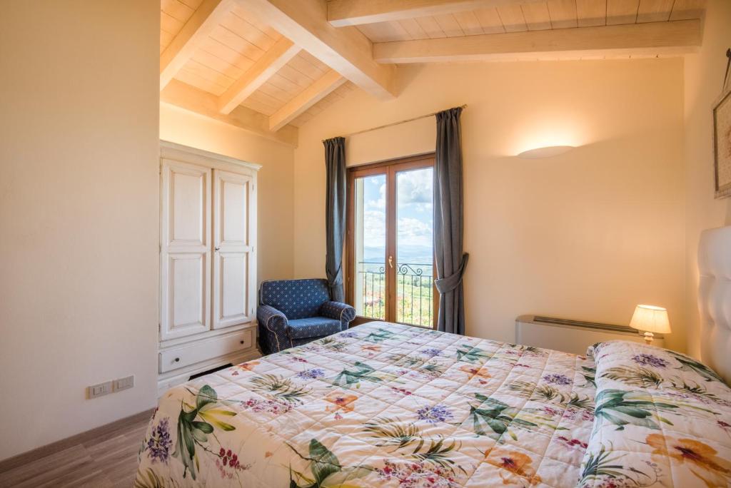 Łóżko lub łóżka w pokoju w obiekcie Casa Vacanze Squarcialupi