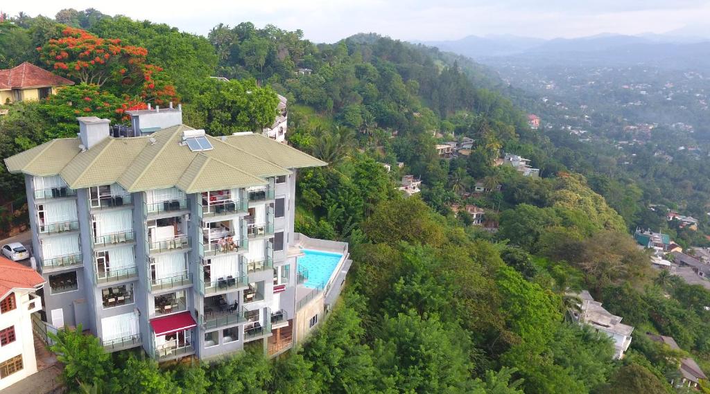 an aerial view of a building on a mountain at Mount Blue Kandy in Kandy