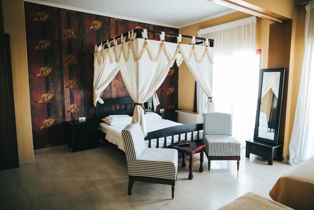 Postel nebo postele na pokoji v ubytování Fanari Hotel