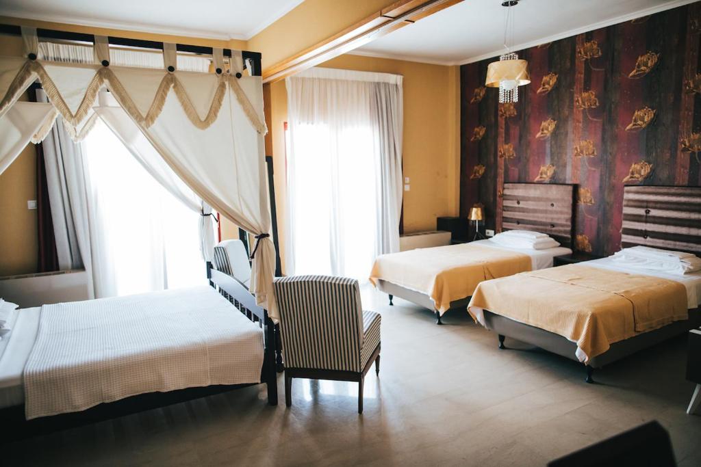 Postel nebo postele na pokoji v ubytování Fanari Hotel
