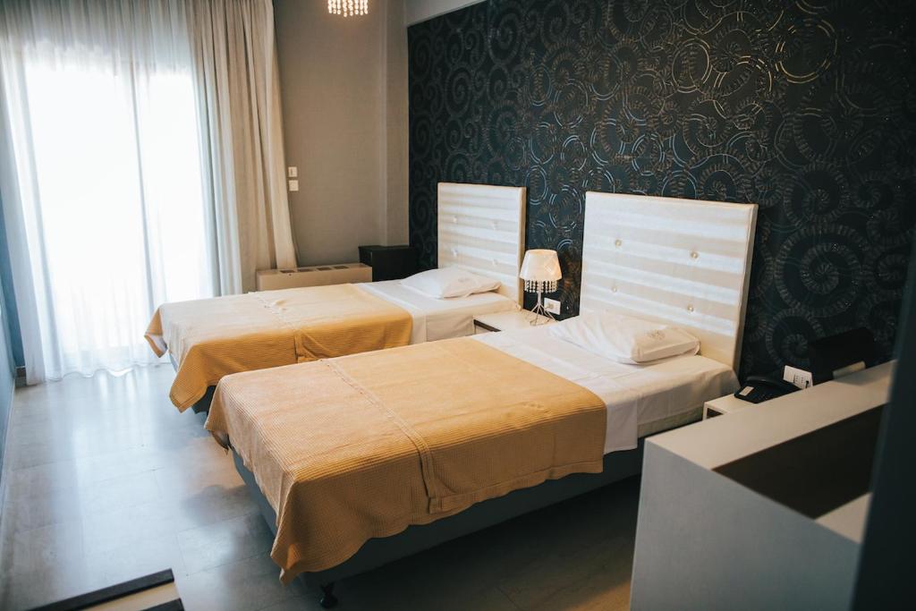 Postel nebo postele na pokoji v ubytování Fanari Hotel