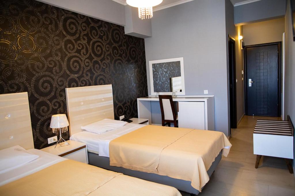 Postel nebo postele na pokoji v ubytování Fanari Hotel