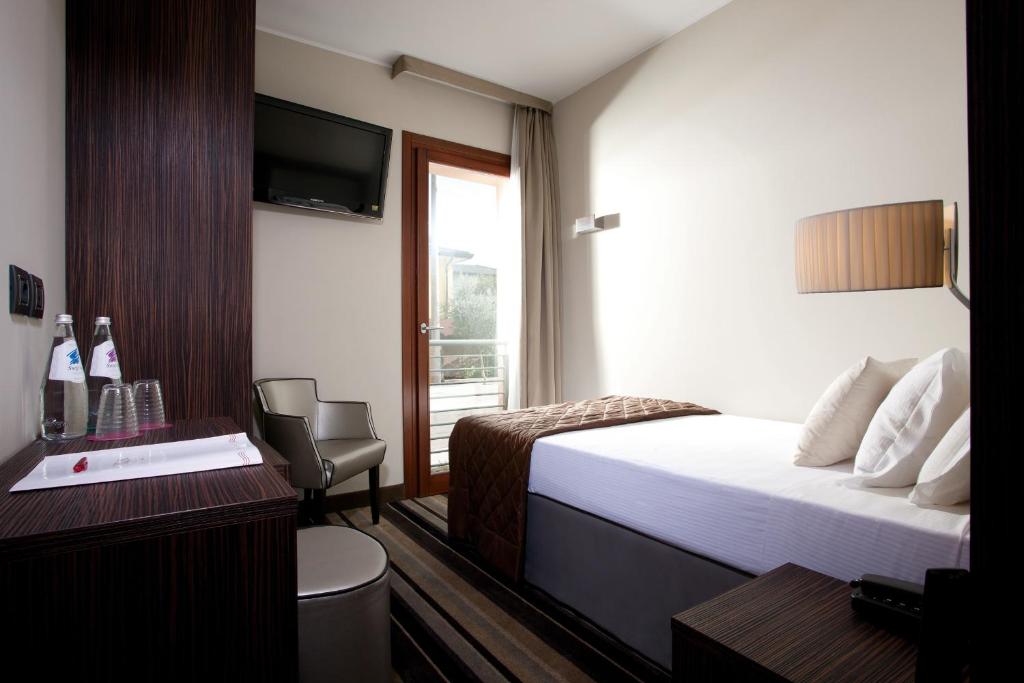 Posteľ alebo postele v izbe v ubytovaní BEST WESTERN Titian Inn Hotel Venice Airport