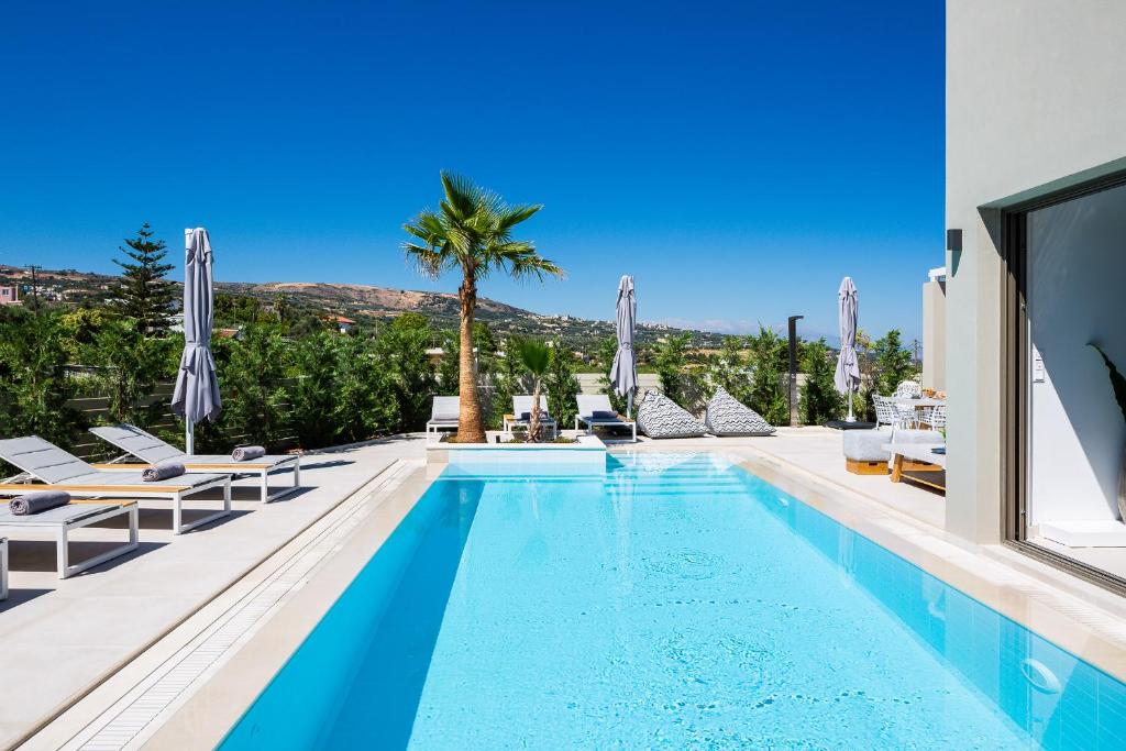 The swimming pool at or close to Vasilios Villa, with Pool, Gym & Close to Beach, By ThinkVilla