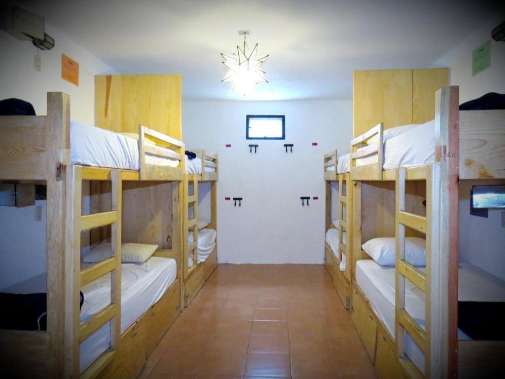 Postel nebo postele na pokoji v ubytování La Catrina Hostel