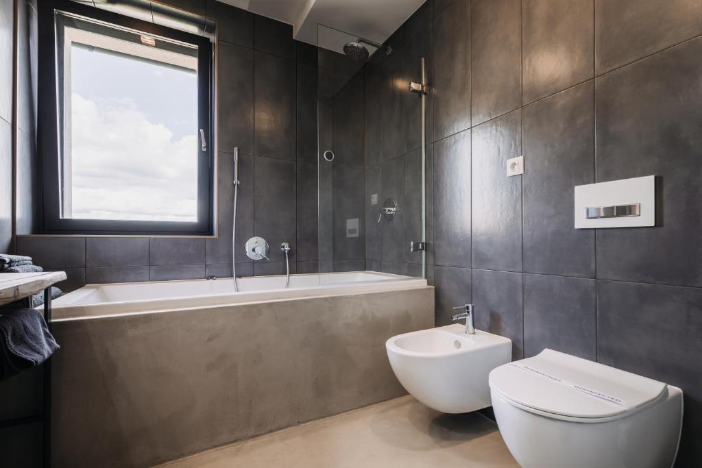 Koupelna v ubytování VILLA BRICOLA - Boutique Apartments