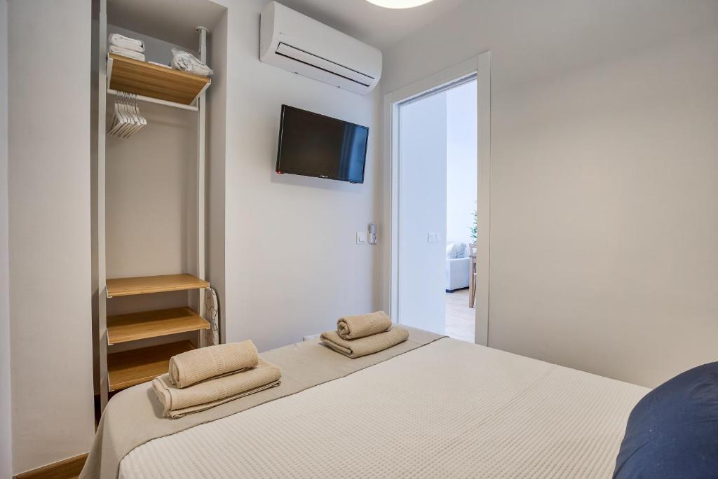 Postel nebo postele na pokoji v ubytování Sur Suites Perla 6-3