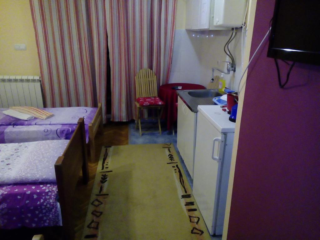 Postel nebo postele na pokoji v ubytování Guest house Mirijevski Konak