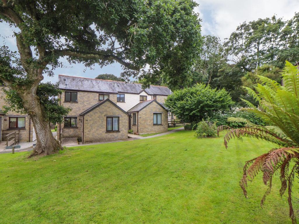 a large house with a large yard in front of it at Deja Blue in Falmouth