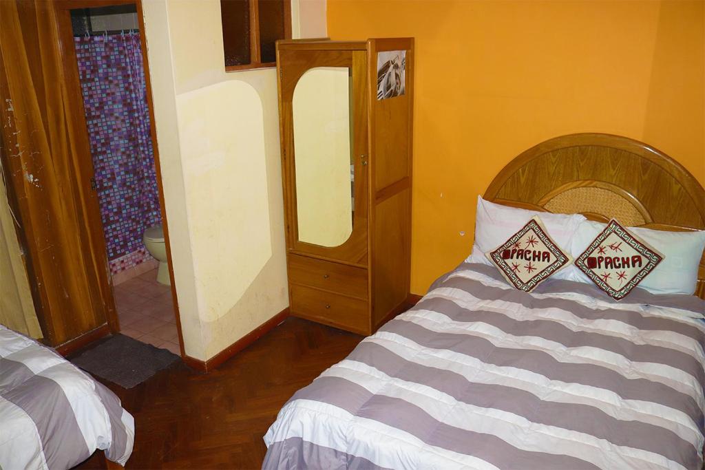 Postel nebo postele na pokoji v ubytování Pacha Suite