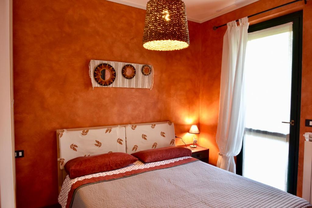 Un pat sau paturi într-o cameră la Holiday Apartment Albachiara