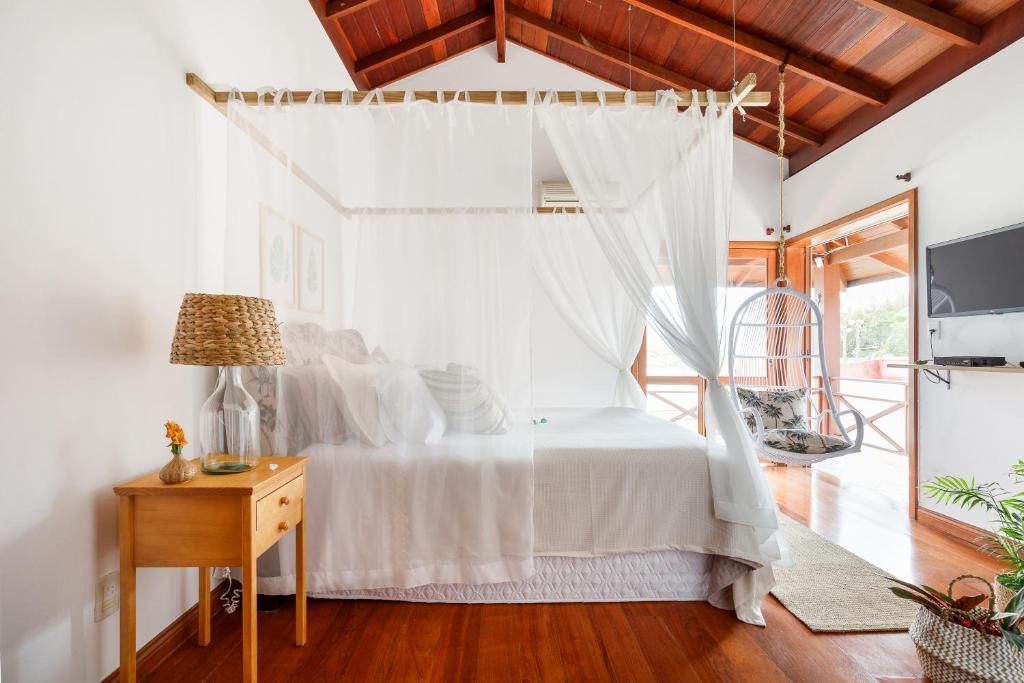 A bed or beds in a room at Casa Paradisíaca na Lagoa da Conceição