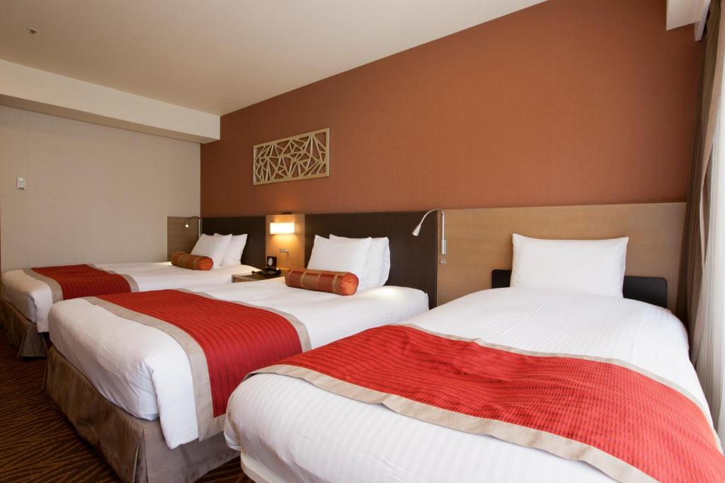 Postel nebo postele na pokoji v ubytování Hotel Sardonyx Tokyo