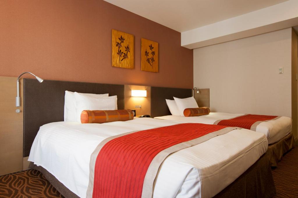 Postel nebo postele na pokoji v ubytování Hotel Sardonyx Tokyo