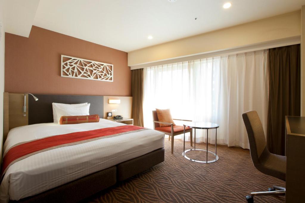 Postel nebo postele na pokoji v ubytování Hotel Sardonyx Tokyo