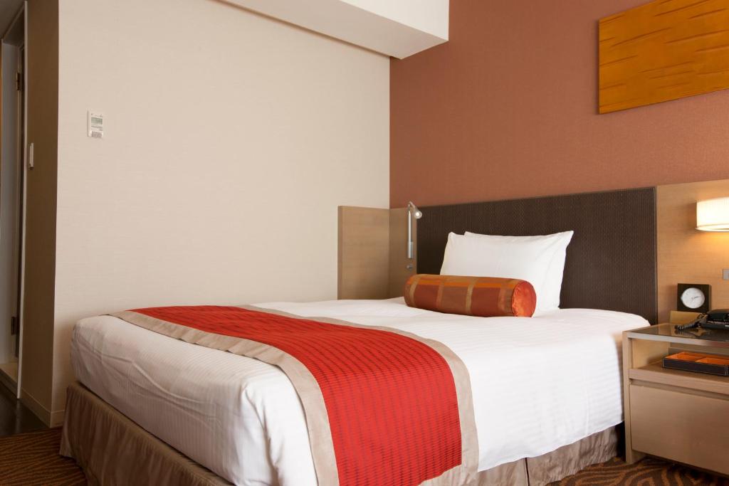 Postel nebo postele na pokoji v ubytování Hotel Sardonyx Tokyo