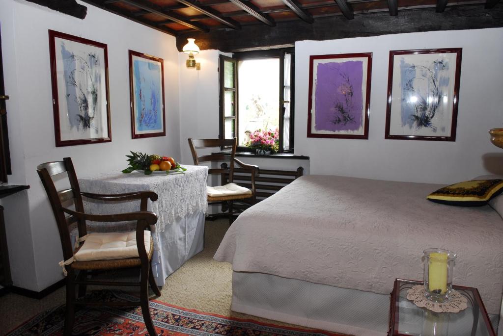 Кровать или кровати в номере Motto del Gallo
