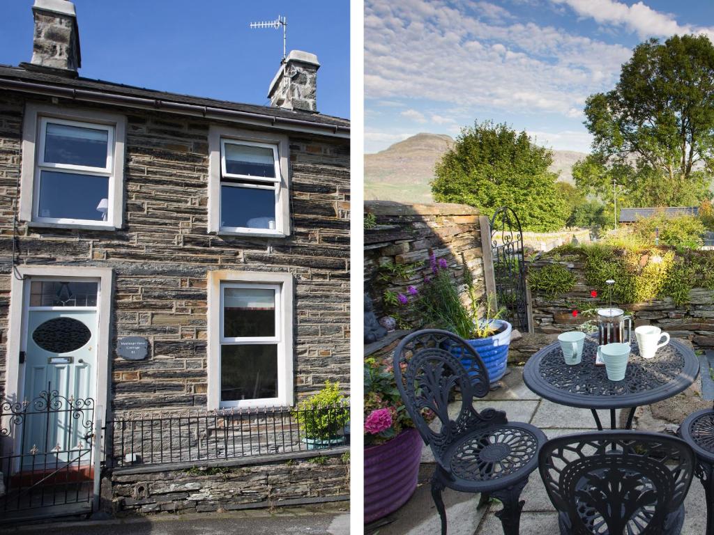 a table and chairs in front of a stone house at Moelwyn View Cottage in Blaenau-Ffestiniog