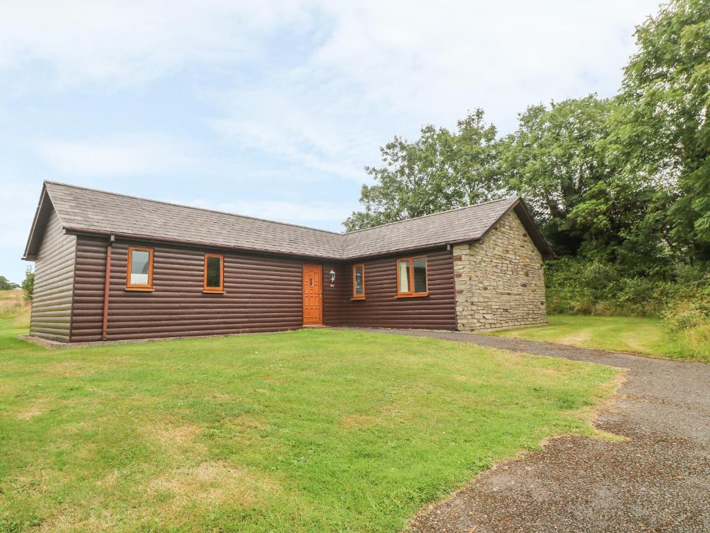 a house with a large yard in front of it at 64 Waterside in Bodmin