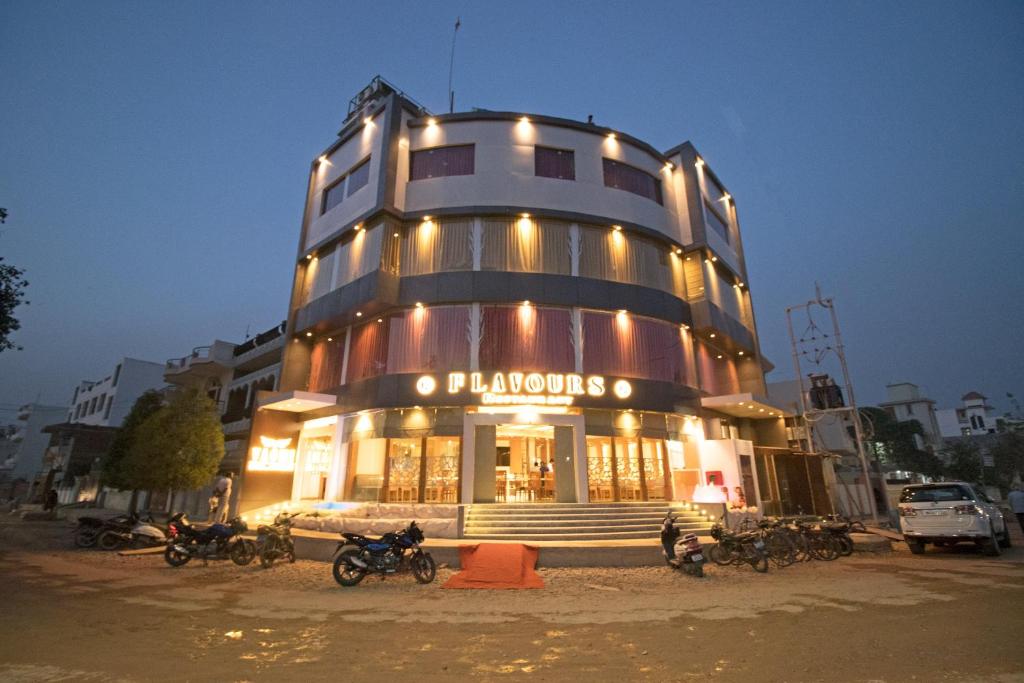 a building with motorcycles parked in front of it at Hotel Vagmi in Varanasi