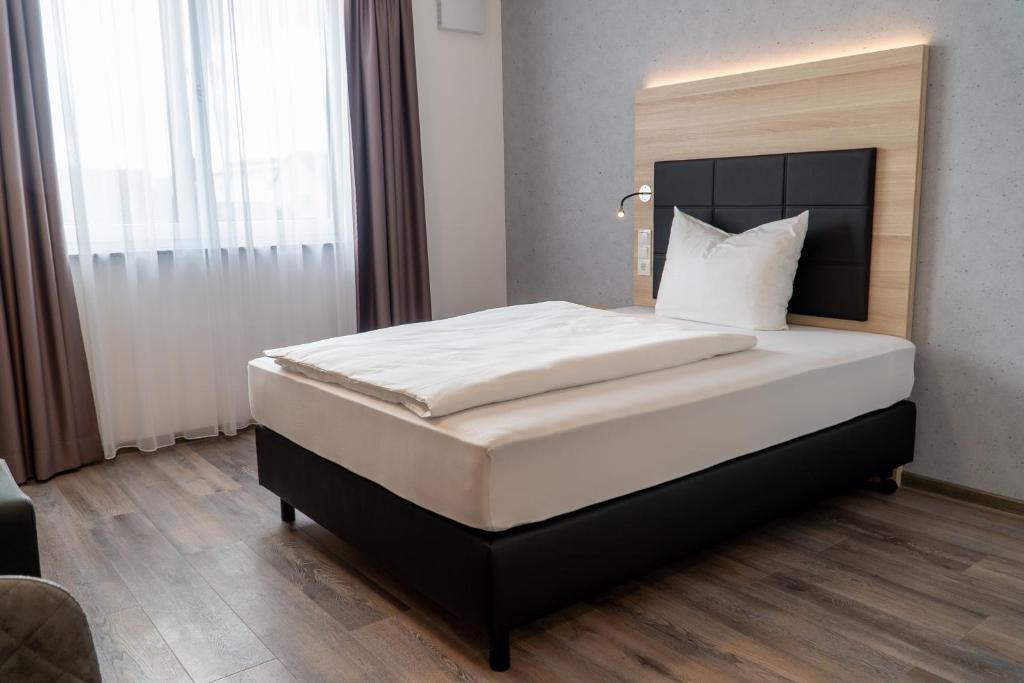 Postel nebo postele na pokoji v ubytování Hotel Schlafplatz