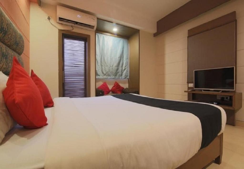 Postel nebo postele na pokoji v ubytování Tangerine Boutique Resort