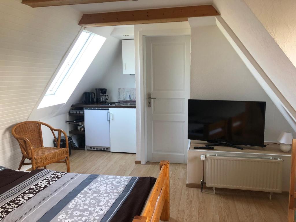 TV a/nebo společenská místnost v ubytování Ferienwohnung 2 Basthorst