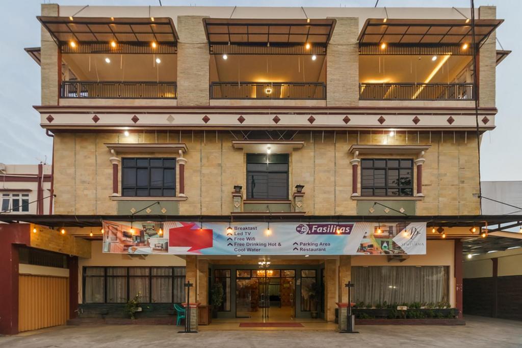 a building with a sign on the front of it at RedDoorz Plus @ Hotel Sempurna Watervang Lubuk Linggau in Lubuklinggau