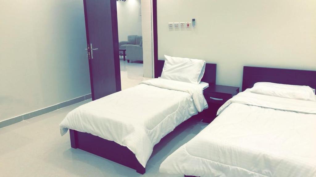 Postel nebo postele na pokoji v ubytování Al Taif Villas