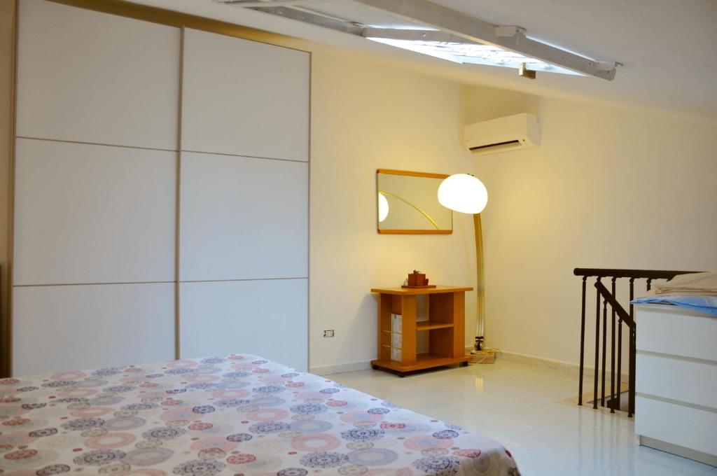 Posteľ alebo postele v izbe v ubytovaní Casa Sperone - Ospedale Papardo