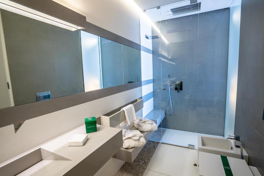 a bathroom with a sink and a mirror at Covo dei Saraceni in Polignano a Mare