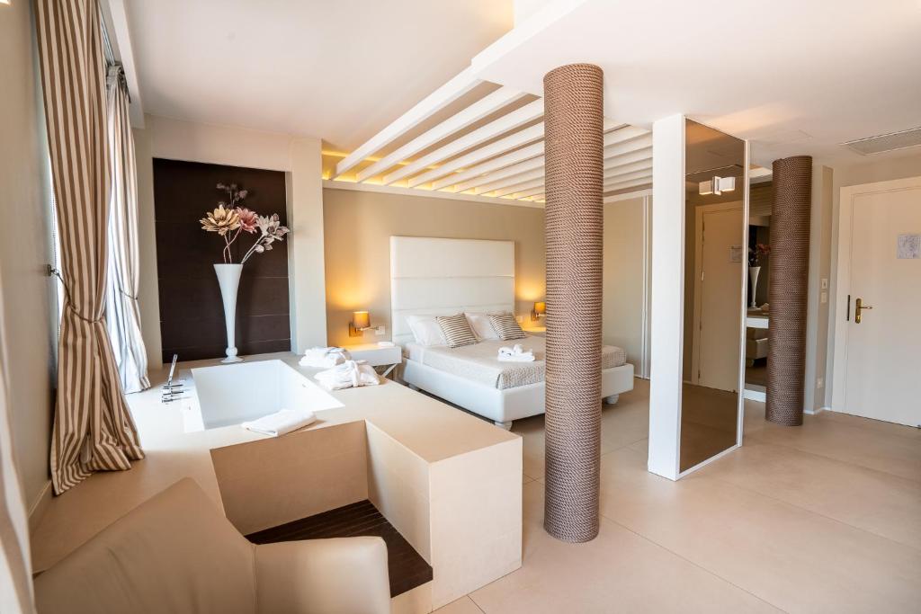 a living room with a couch and a bed at Covo dei Saraceni in Polignano a Mare