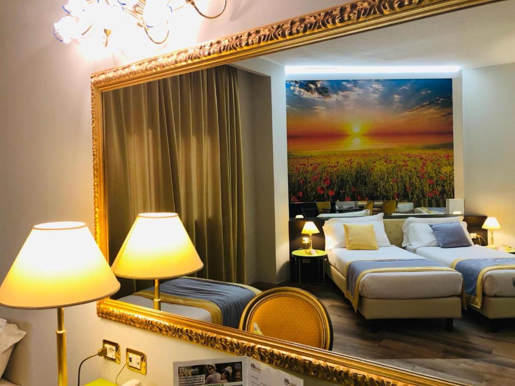 Postel nebo postele na pokoji v ubytování AS Hotel Sempione Fiera