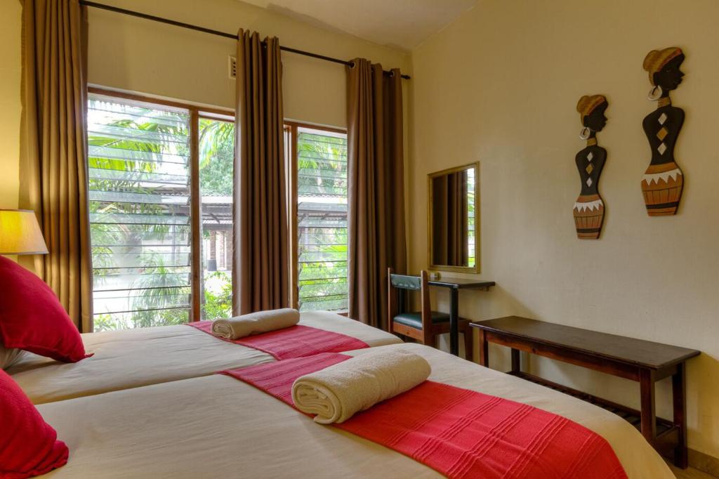 מיטה או מיטות בחדר ב-Shonalanga Lodge