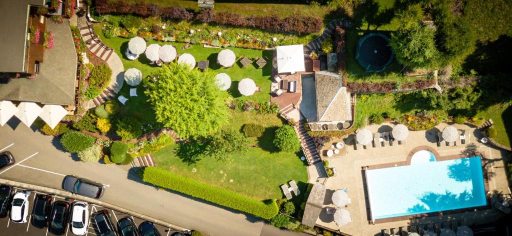 an aerial view of a mansion with a swimming pool at Hotel & Spa Le Dahu in Morzine