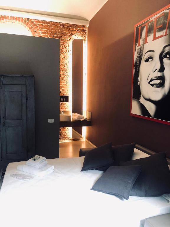 Postel nebo postele na pokoji v ubytování Santa Giulia Hotel e Residence Torino