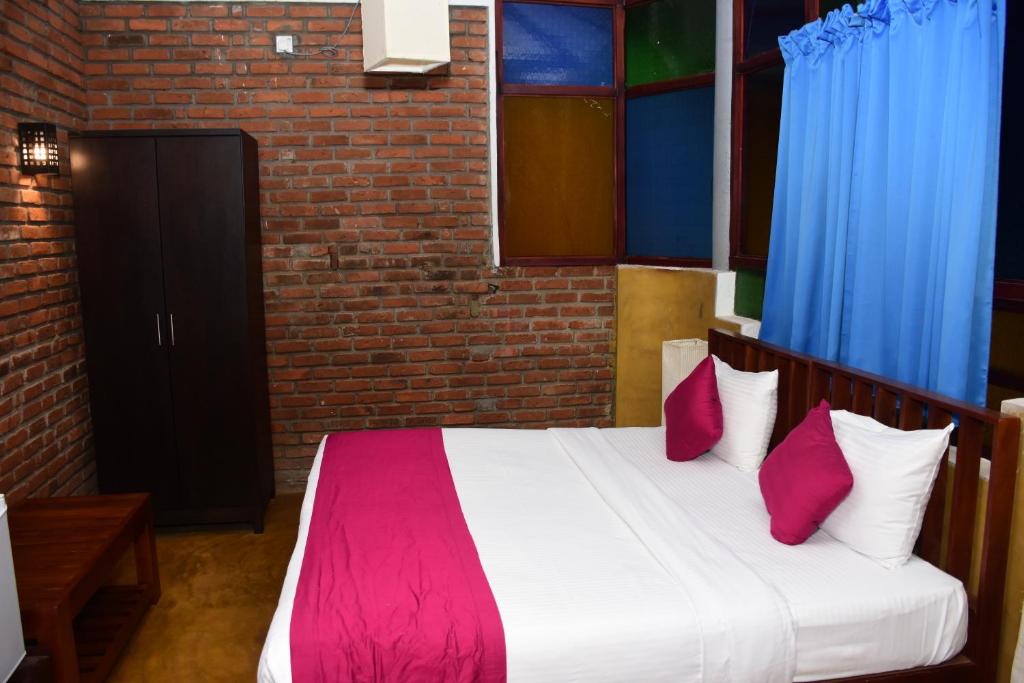 Postel nebo postele na pokoji v ubytování Pavana Hotel