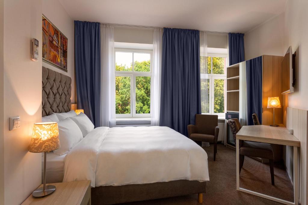 Postel nebo postele na pokoji v ubytování Radisson Hotel Old Town Riga