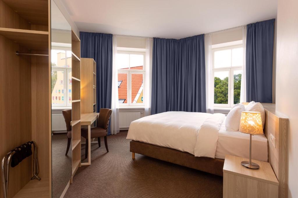 Postel nebo postele na pokoji v ubytování Radisson Hotel Old Town Riga