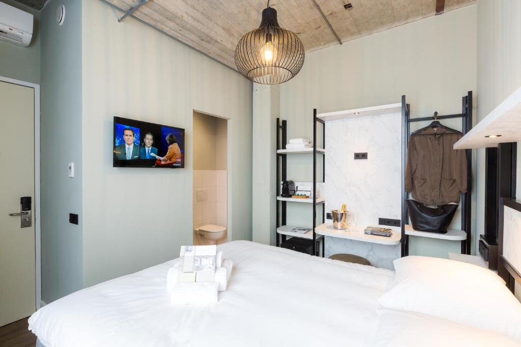 TV a/nebo společenská místnost v ubytování Boutique Hotel Lumiere